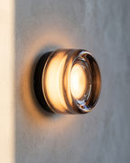 Wall Lamp - OVA, smoke grey glass dome on a matte black aluminium base, view 3
