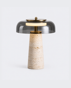 Essential Cozze, smoked glass dome on a natural travertine base